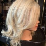 Blond, shoulder-length, right side view.