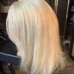 Blond, shoulder-length, back view.