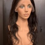 Human hair wig natural very dark brown wavy hair, facing right.