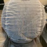 Human hair wig in progress, back view. Ash blond highlights light brown base, 23” long 200% density.