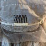 Human hair wig in progress, with the comb. Ash blond highlights light brown base, 23” long 200% density.