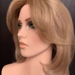 Light brown, shoulder-length, layers around face, left side view