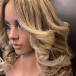 Blond highlights with curls, left view.