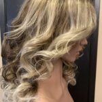Blond highlights with curls, right side view.