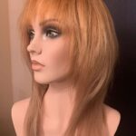 Straight with bangs and long layers, left view.